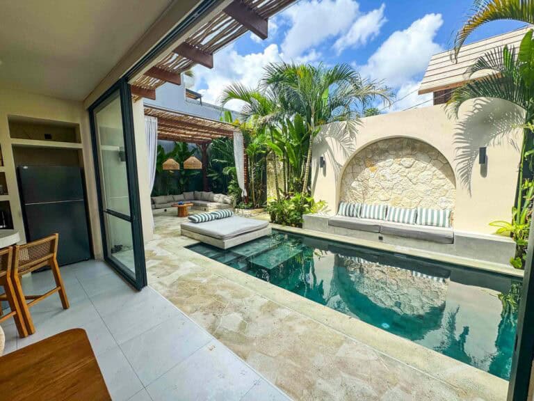 Luxurious outdoor patio with pool and seating area.